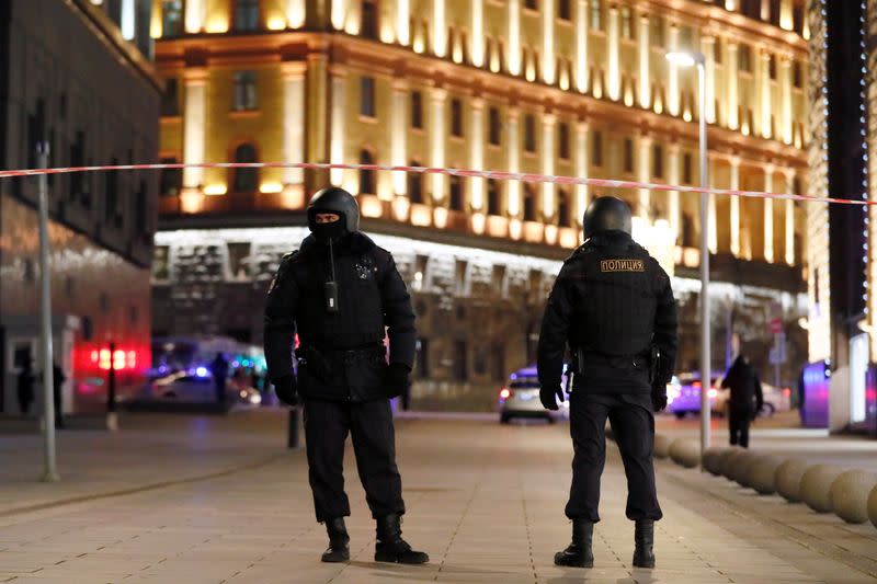 Security officers block a street near the Federal Security Service (FSB) building after a shooting incident, in Moscow