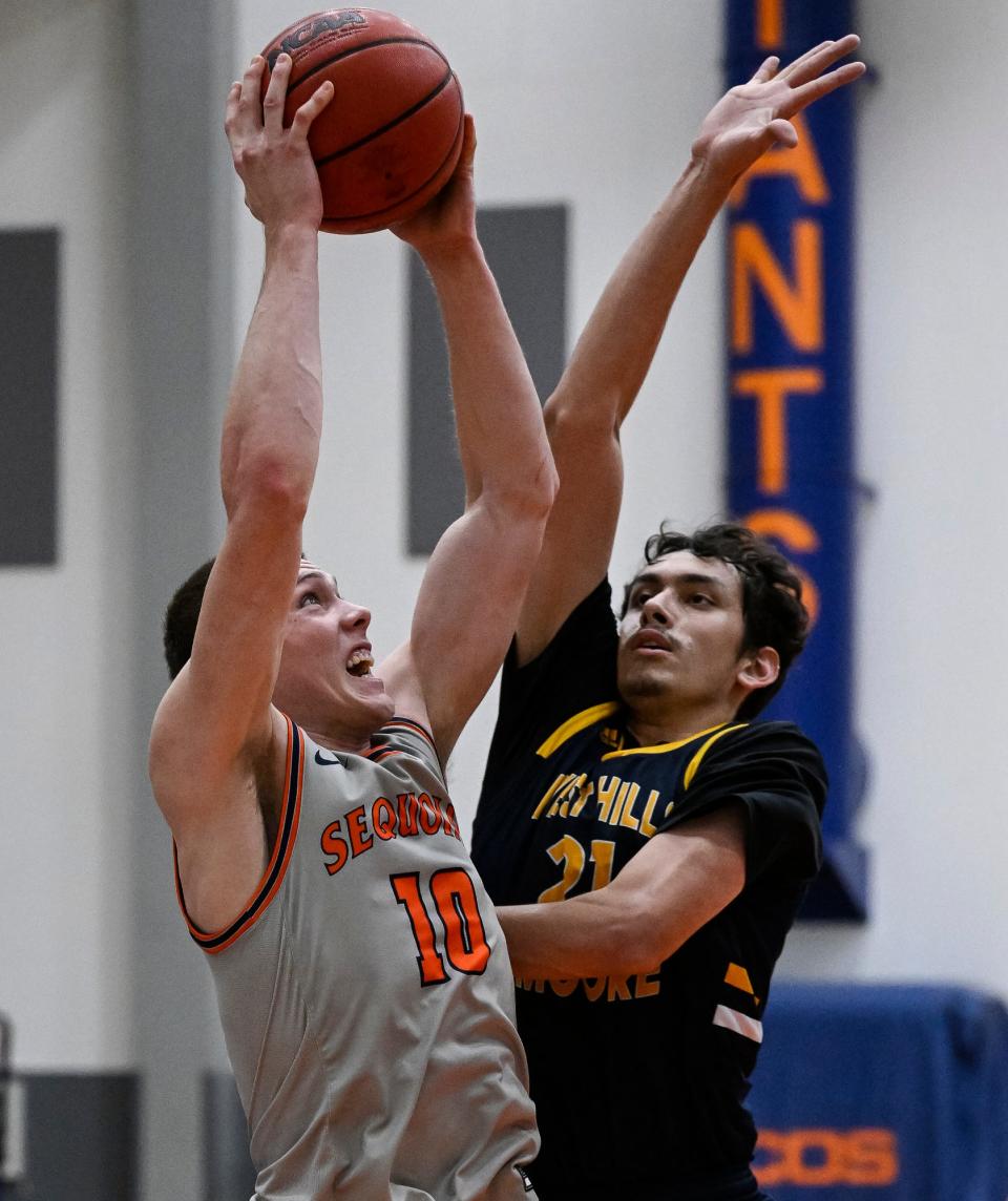 College of the Sequoias' Ryan Johnson goes up for two against West Hills College-Lemoore's Jose Martinez in mens basketball on Wednesday, January 26, 2022. 