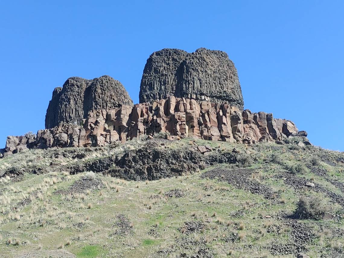 Twin Sisters Rock at Wallula Gap consists of twin basalt pillars left by the Missoula floods that swept periodically through the Columbia Basin. More prosaically, Native American legend holds they were two of three wives of the trickster god Coyote, who turned two into rock and one into a cave when he became bored.