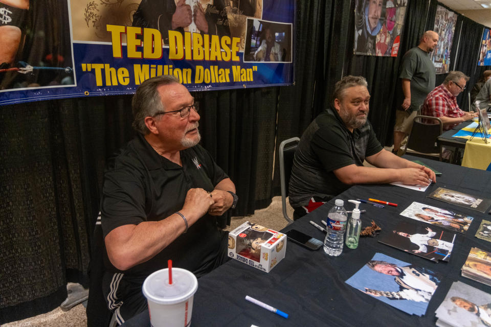 Ted DiBiase, the "Million Dollar Man," chats with a fan Saturday at the Amarillo Super Mini-Con at the Amarillo Civic Center.