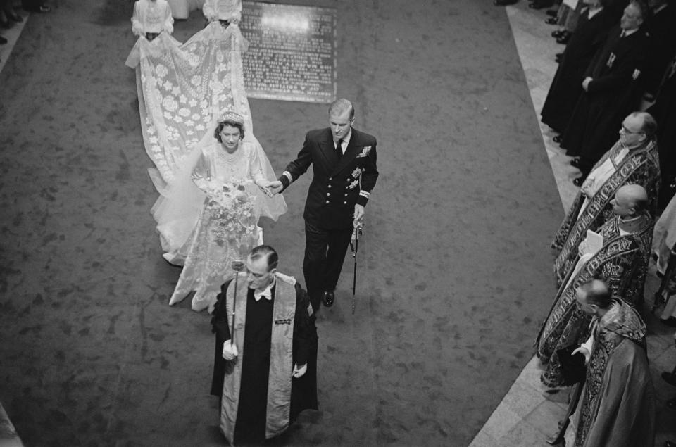 Princess Elizabeth and Prince Philip make their way down the aisle of Westminster Abbey, London, on their wedding day, on Nov. 20, 1947.<span class="copyright">Bert Hardy—Picture Post/Hulton Archive/Getty Images</span>