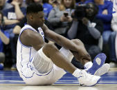 FILE - In this Wednesday, Feb. 20, 2019, file photo, Duke's Zion Williamson sits on the floor following an injury during the first half of an NCAA college basketball game against North Carolina, in Durham, N.C. As his Nike shoe blew out, Williamson sprained his right knee on the first possession of what became top-ranked Duke's 88-72 loss to No. 8 North Carolina. (AP Photo/Gerry Broome, File)