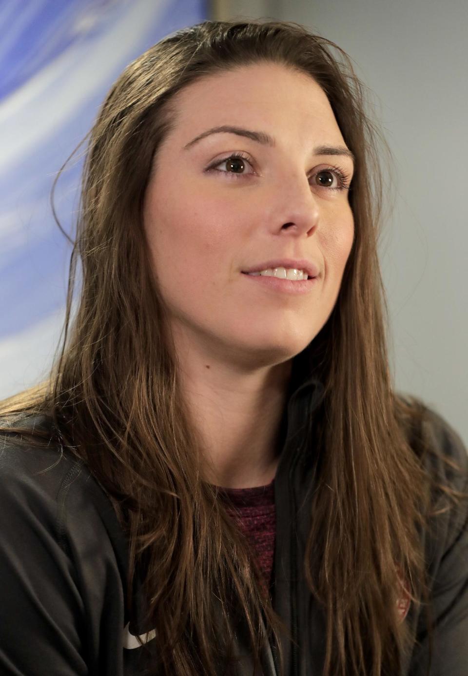 FILE - In this Feb. 7, 2017, file photo, WNHL player Hilary Knight answers questions during an interview in New York. The U.S. women's hockey team is threatening to boycott the world championships because of a wage dispute. The team announced Wednesday that they will not participate in the International Ice Hockey Federation tournament that begins March 31, 2017, in Plymouth, Michigan. (AP Photo/Julie Jacobson, File)