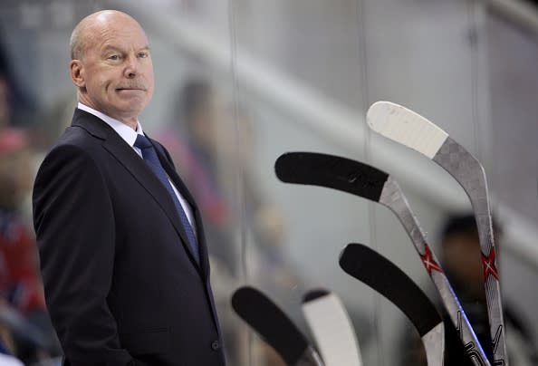 TO GO WITH AFP STORY BY GABRIELLE TETRAULT-FARBER<br>A September 11, 2015 photo shows Metallurg Magnitogorsk ice hockey team coach, Canadian Mike Keenan, standing during a Kontinental Hockey League’s (KHL) match against CSKA in Moscow. Keenan, nicknamed “Iron Mike” for his iron-fisted coaching style and temper tantrums, is the only coach to have won trophies in both the National Hockey League (NHL, North America) and KHL, the world’s top two leagues. AFP PHOTO / ALEXANDER NEMENOV (Photo credit should read ALEXANDER NEMENOV/AFP/Getty Images)