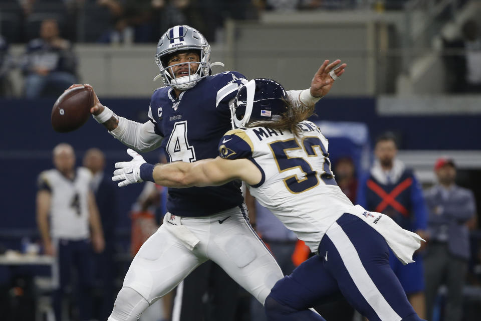 Dallas Cowboys quarterback Dak Prescott (4) passes under pressure from Los Angeles Rams outside linebacker Clay Matthews (52) in the first half of an NFL football game in Arlington, Texas, Sunday, Dec. 15, 2019. (AP Photo/Ron Jenkins)