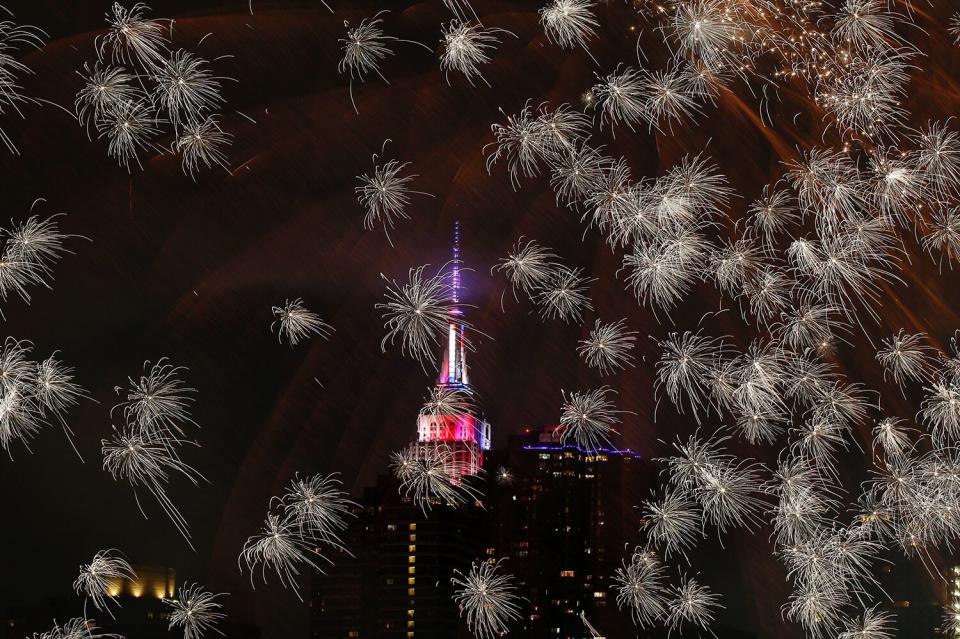 The Empire state Building is seen during the Macy's 4th of July fireworks show from Queens, New York on July 4, 2017.