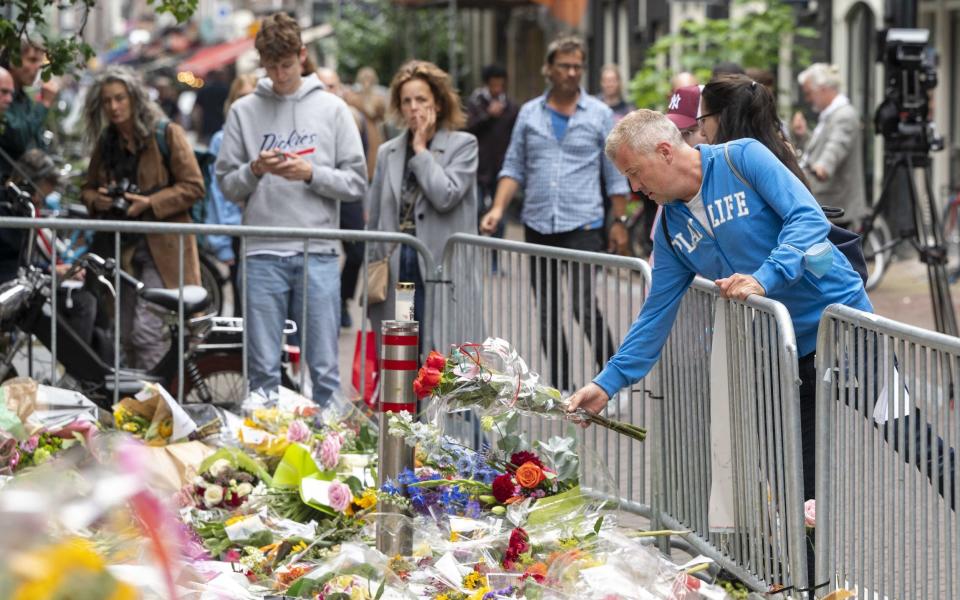 In central Amsterdam, people laid flowers in Mr de Vries' memory - Shutterstock