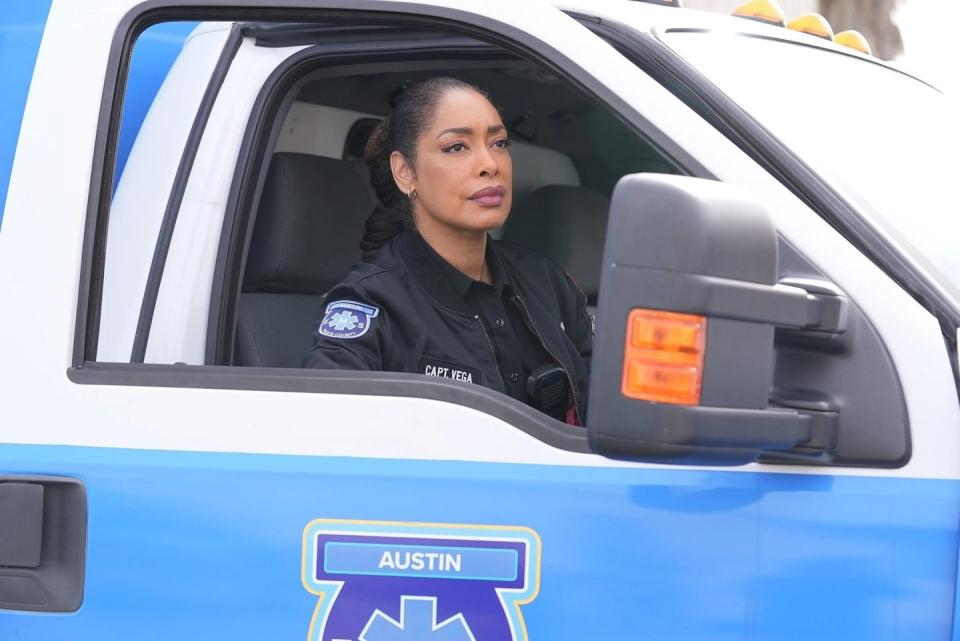 gina torres as tommy vega in 911 lone star, sitting in an ambulance