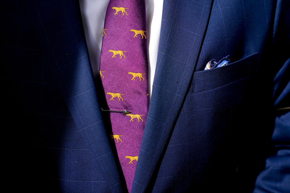 A handler wears a dog-themed tie during breed judging during the 147th Westminster Kennel Club Dog show, Monday, May 8, 2023, at the USTA Billie Jean King National Tennis Center in New York. (AP Photo/John Minchillo)