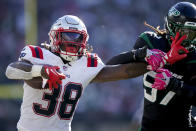 New England Patriots running back Rhamondre Stevenson (38) stiff-arms New York Jets linebacker C.J. Mosley (57) during the third quarter of an NFL football game, Sunday, Oct. 30, 2022, in New York. (AP Photo/John Minchillo)