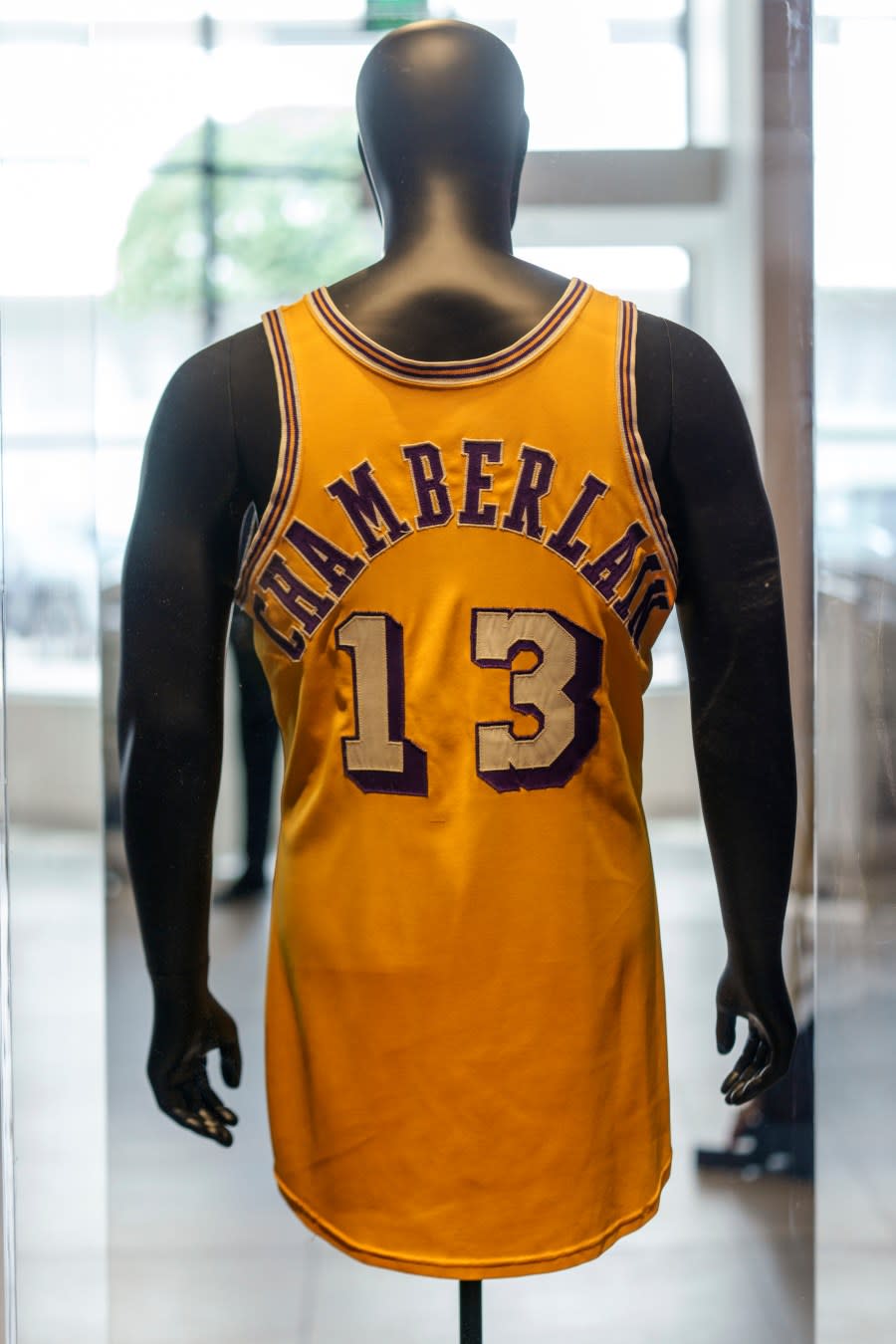 The back of Wilt Chamberlain’s 1972 NBA Finals ‘Championship Clinching’ Jersey, from is previewed at Sotheby’s Los Angeles Gallery on Tuesday, Aug. 1, 2023, in Beverly Hills, Calif. The jersey is being offered along with a collection of memorabilia in an online sale Aug. 28-Sept. 27. (AP Photo/Damian Dovarganes)