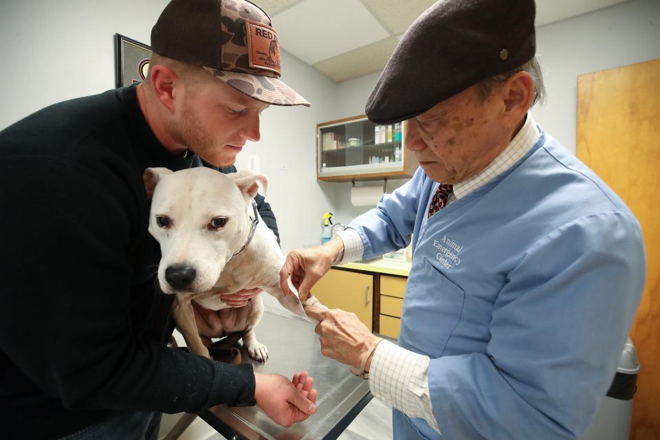 Dr. Gary Tran checks on a patient at his veterinary practice. Tran is 85 years old and still works the night shift at the emergency animal hospital. He can't sell his practice, because "no one wants it." All of his children became engineers.