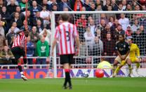 <p>Sunderland’s Darren Bent scores the only goal of the game against Liverpool in 2009 after his shot rebounded off a beach ball that had been thrown onto the pitch </p>