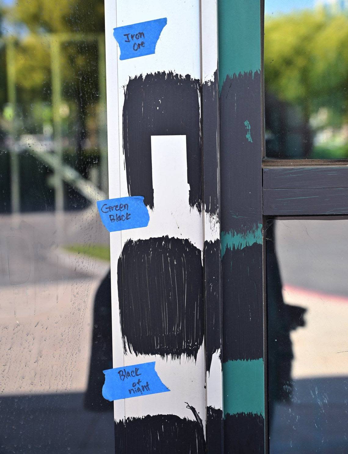 Painted swatches are left along the front door at the former Sweet Tomatoes which is being converted to offices.