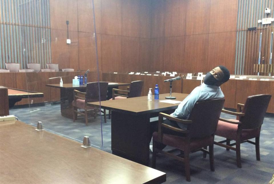 Drevon Johnson sits alone at the defense table during jury deliberations Tuesday, April 27, 2021.