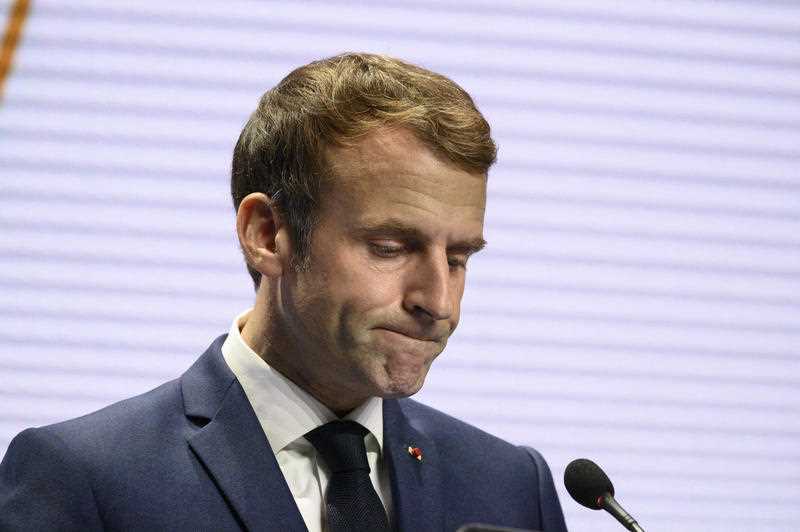 France's President Emmanuel Macron gestures as he addresses media representatives at a press conference in Rome, Italy.