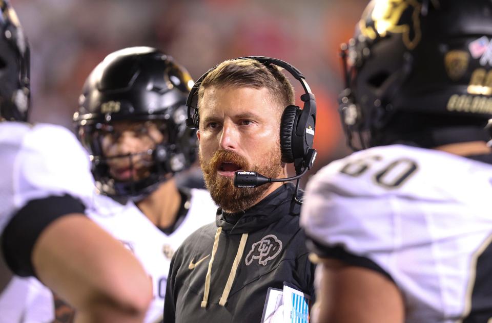 Colorado head coach Mike Sanford Jr. talks to players during the third quarter against Oregon State at Reser Stadium in Corvallis, Ore. on Saturday, Oct. 22, 2022.