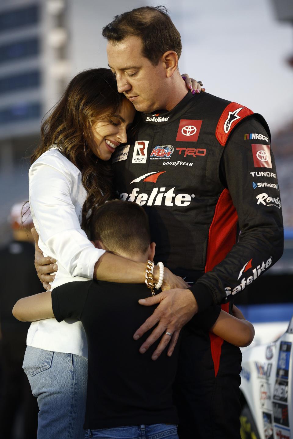 CONCORD, NORTH CAROLINA - MAY 27: Kyle Busch, driver of the #51 Safelite Toyota, wife Samantha and son Brexton embrace on the grid prior to the NASCAR Camping World Truck Series North Carolina Education Lottery 200 at Charlotte Motor Speedway on May 27, 2022 in Concord, North Carolina. (Photo by Jared C. Tilton/Getty Images) | Getty Images