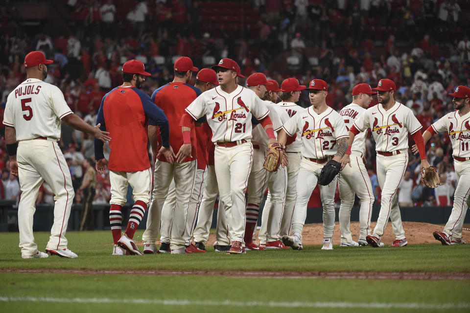 St. Louis Cardinals celebrate their team's 8-4 victory in a baseball game against the Chicago Cubs on Saturday, Sept. 3, 2022, in St. Louis. (AP Photo/Joe Puetz)