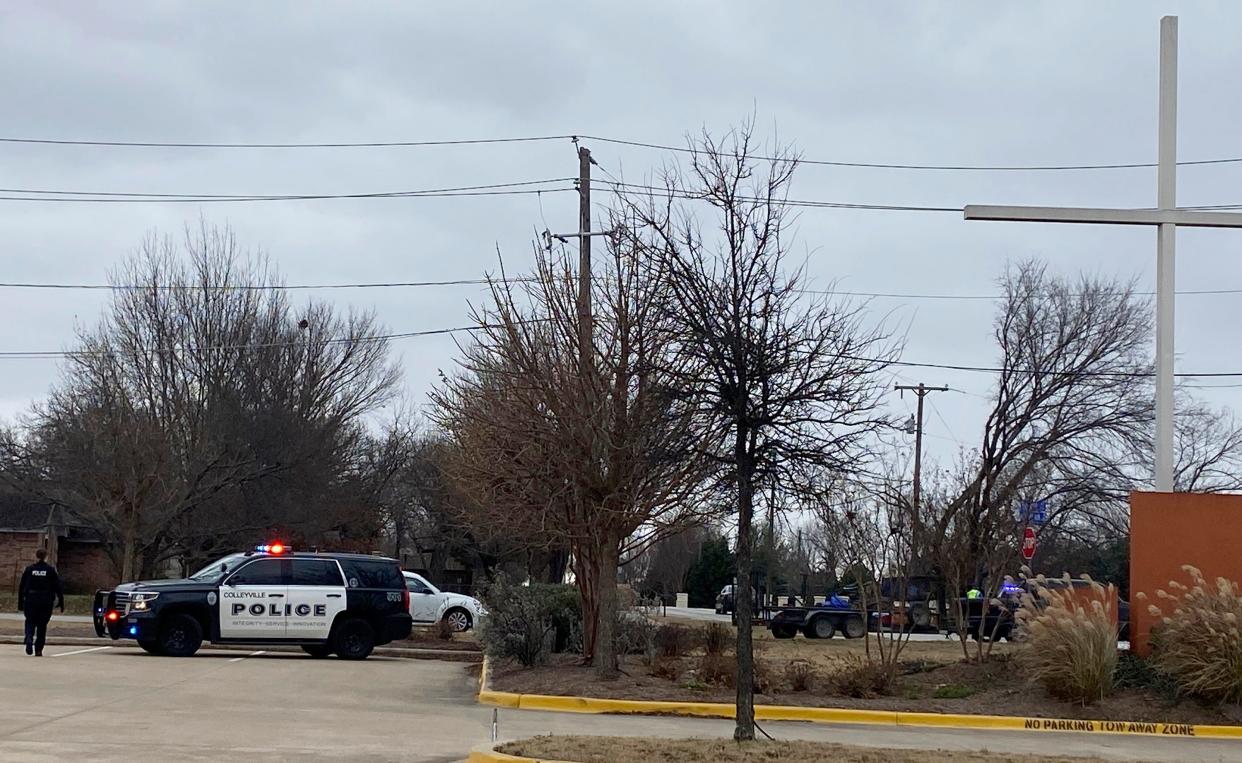 Colleyville police secure the area around Congregation Beth Israel synagogue on Saturday, Jan. 15, 2022 in Colleyville, Texas.   Authorities say a man has apparently taken hostages at the synagogue near Fort Worth, Texas. The Colleyville Police Department tweeted Saturday afternoon that it was conducting SWAT operations at the address of Congregation Beth Israel