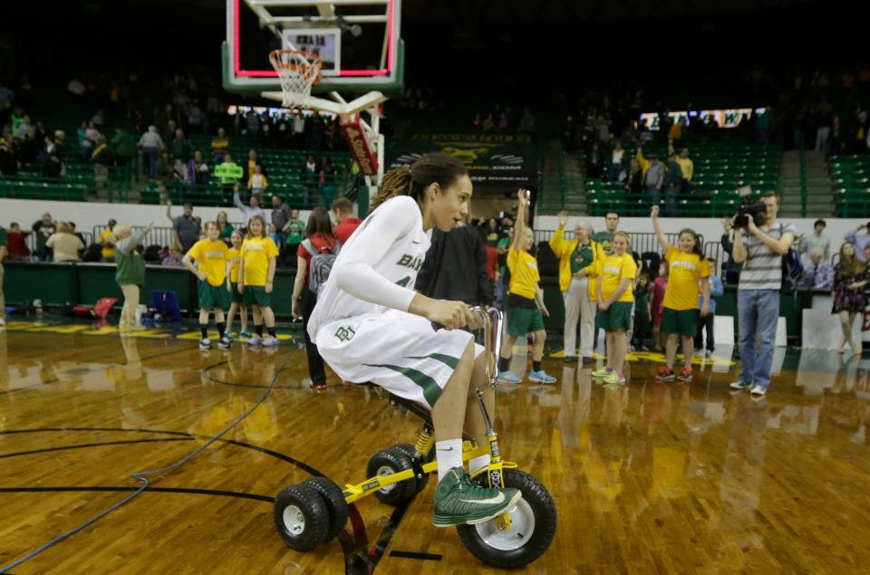 Baylor's Brittney Griner rides a tricycle after the NCAA college basketball game against Texas Tech Tuesday, Feb. 12, 2013, in Waco, Texas. Baylor won 89-47.