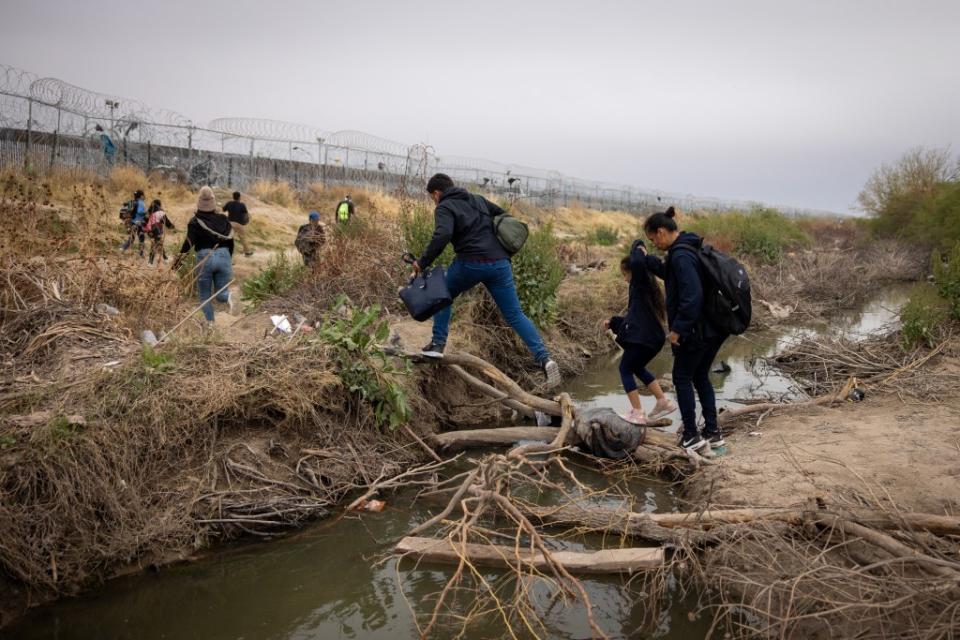 Migrants continued to cross the Rio Grande river into the United States. James Breeden / MEGA