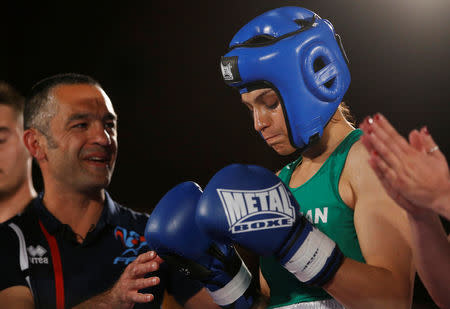 FILE PHOTO: Iranian boxer Sadaf Khadem and coach Mahyar Monshipour react before the fight against French boxer Anne Chauvin during an official boxing bout in Royan, France, April 13, 2019. REUTERS/Stephane Mahe