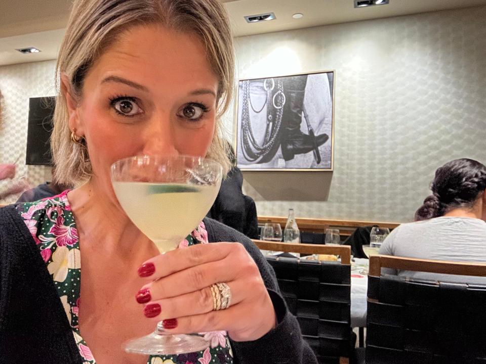 terri taking a sip of a mocktail at fogo de chao