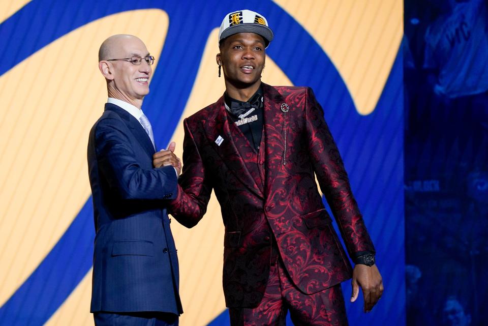 Bennedict Mathurin is congratulated by NBA Commissioner Adam Silver after being selected sixth overall by the Indiana Pacers in the NBA basketball draft, Thursday, June 23, 2022, in New York. (AP Photo/John Minchillo)