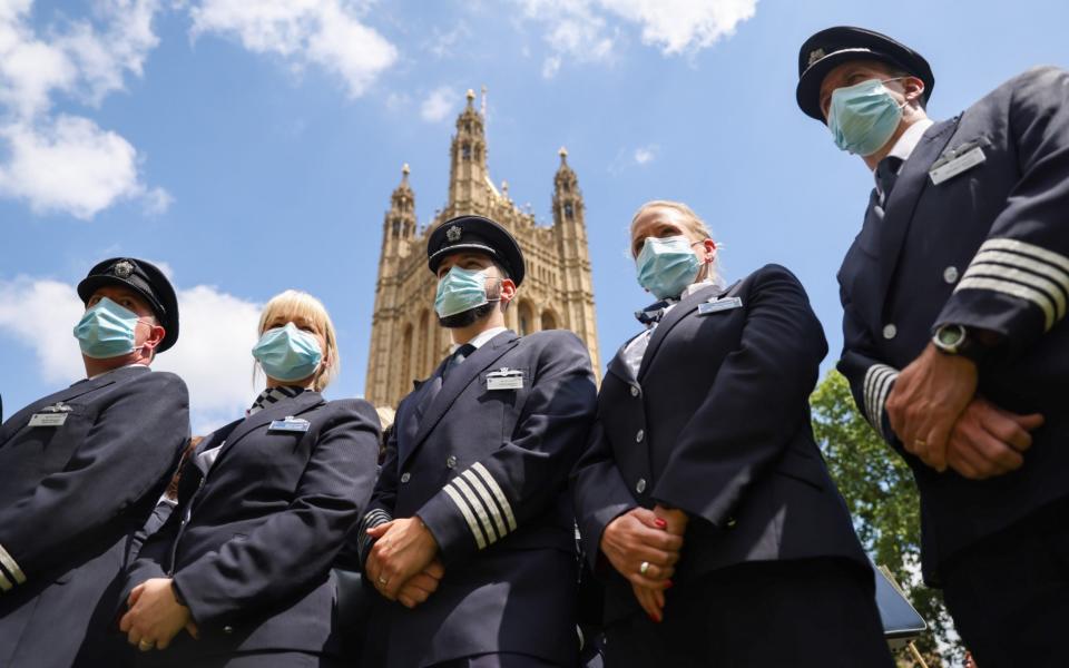 Protesters from British Airways stand near the Houses of Parliament