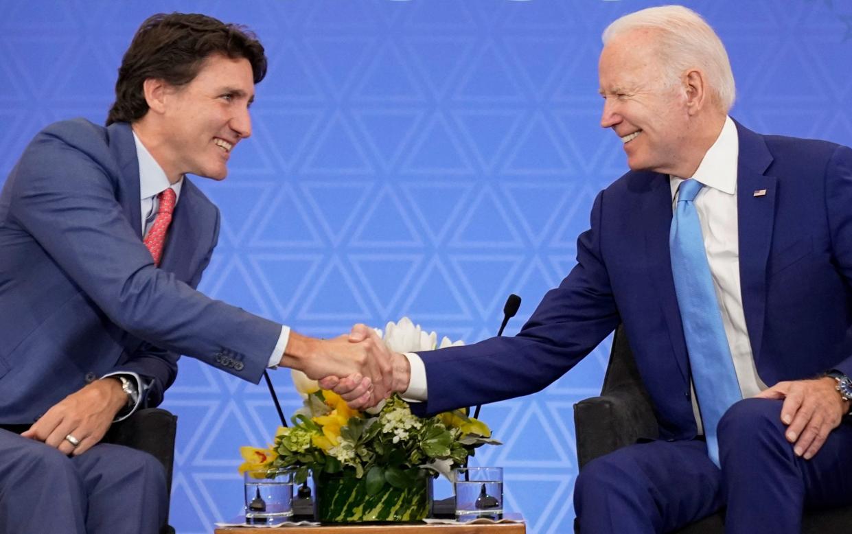 Justin Trudeau and Joe Biden will meet for talks in Ottawa on Thursday - AP