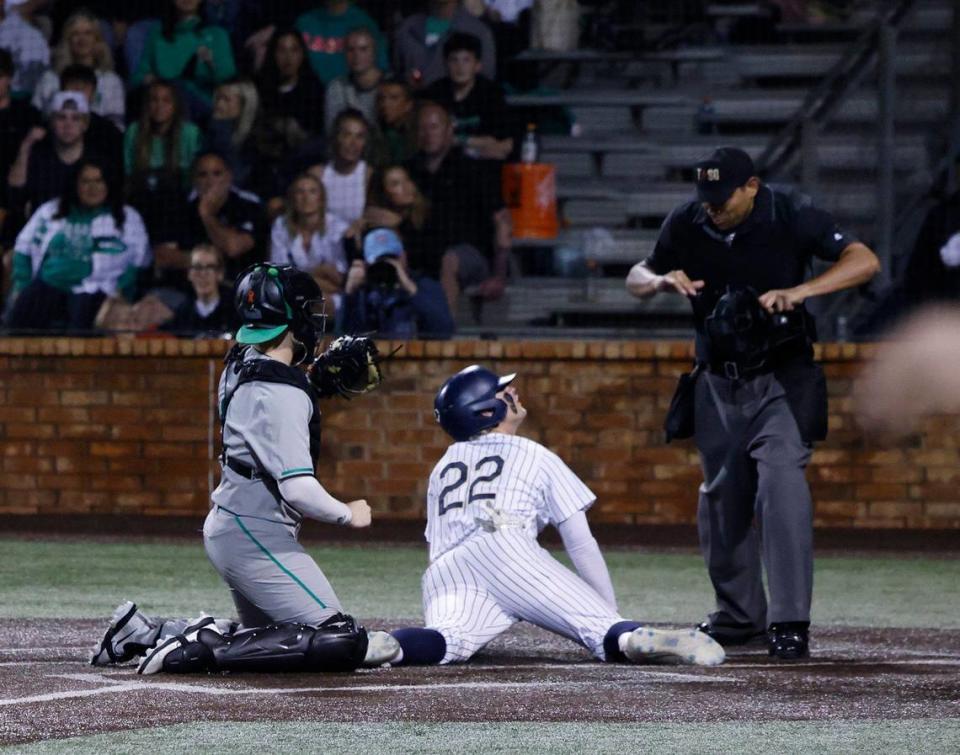 Keller left fielder Brady Reeves checks with the home plate umpire after stealing home during a UIL District 6A Region 1 Quarterfinals baseball game at L.D. Bell in Hurst, Texas, Thursday, May 16, 2024.