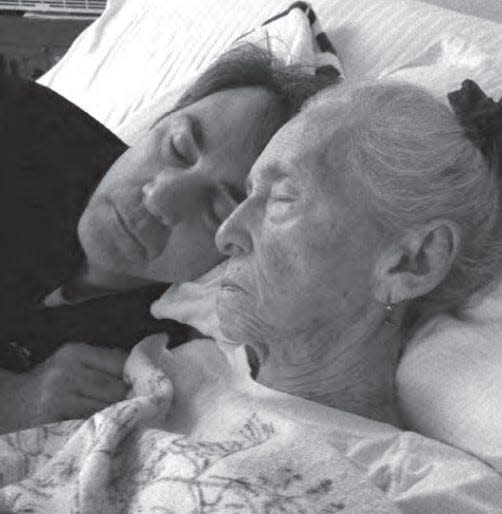 Author Mark Porro takes a break with mother Genevieve while caring for her.