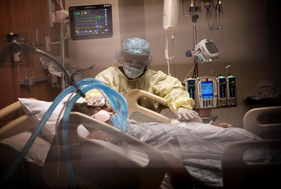 Image: A nurse attends to a COVID-19 patient at the Stamford Hospital ICU in Connecticut on April 24, 2020. (John Moore / Getty Images)