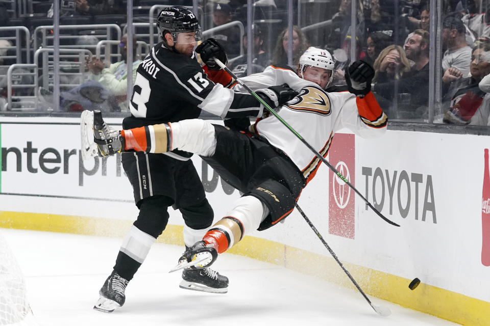 Los Angeles Kings center Gabriel Vilardi, left, pushes Anaheim Ducks defenseman Simon Benoit into the boards during the second period of a preseason NHL hockey game Sunday, Oct. 2, 2022, in Los Angeles. (AP Photo/Mark J. Terrill)