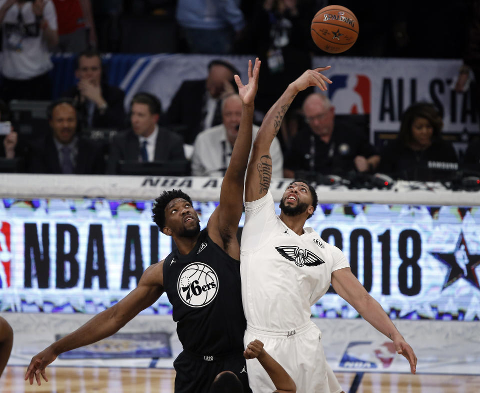 Team Stephen’s center Joel Embiid, left, of the Philadelphia 76ers leaps for the tip off won by Team LeBron’s forward Anthony Davis of the New Orleans Pelicans during the first half of the NBA All-Star basketball game on Sunday. (AP)