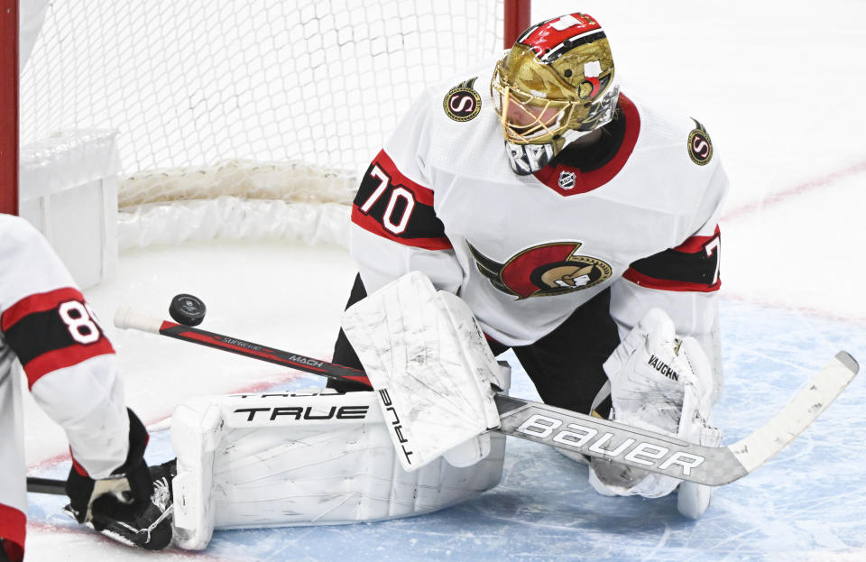 Ottawa Senators goaltender Joonas Korpisalo makes a save against the Montreal Canadiens during the third period of an NHL hockey game in Montreal, Tuesday, Jan. 23, 2024. (Graham Hughes/The Canadian Press via AP)