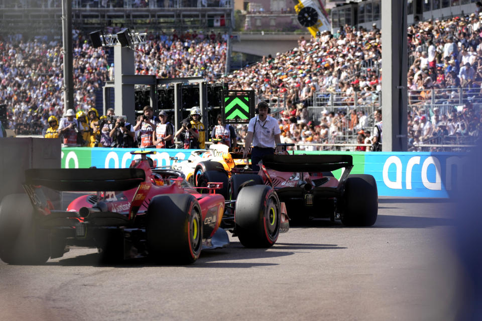 Ferrari driver Charles Leclerc of Monaco and Ferrari driver Carlos Sainz of Spain steer their cars during the Formula One qualifying session at the Monaco racetrack, in Monaco, Saturday, May 27, 2023. The Formula One race will be held on Sunday. (AP Photo/Luca Bruno)