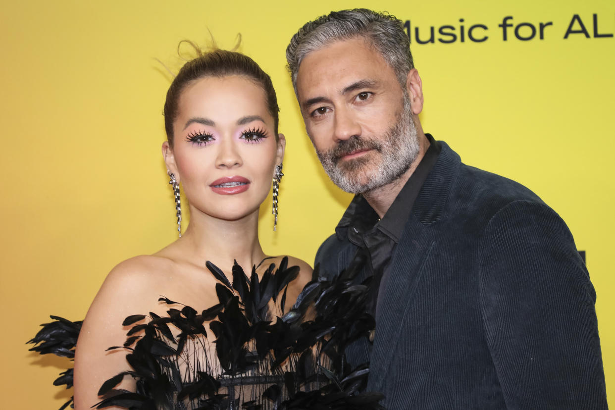 Rita Ora, left, and Taika Waititi pose for photographers upon arrival at the European MTV Awards in Budapest, Hungary, Sunday, Nov. 14, 2021. (Photo by Vianney Le Caer/Invision/AP)