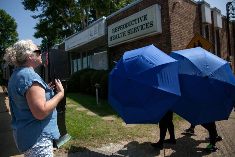 An anti-abortion protester shouts as a woman is escorted into the Reproductive Health Services building in Montgomery, Alabama, on May 20, 2019. (Photo: SETH HERALD via Getty Images)