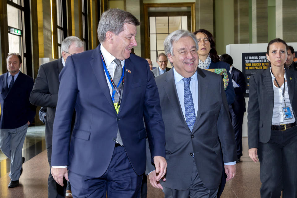 Guy Ryder, Director General of the International Labour Organisation, left, and United Nations Secretary-General Antonio Guterres, right, arrive for the closing session of the the 108th International Labour Conference at the European headquarters of the United Nations in Geneva, Switzerland, Friday, June 21, 2019. (Magali Girardin/Keystone via AP)