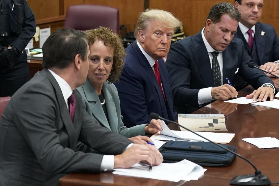 Donald Trump sits at the defence table with his defence team in a Manhattan courtroom in April in New York charged with falsifying business records in a hush money investigation. (AP Photo/Seth Wenig)