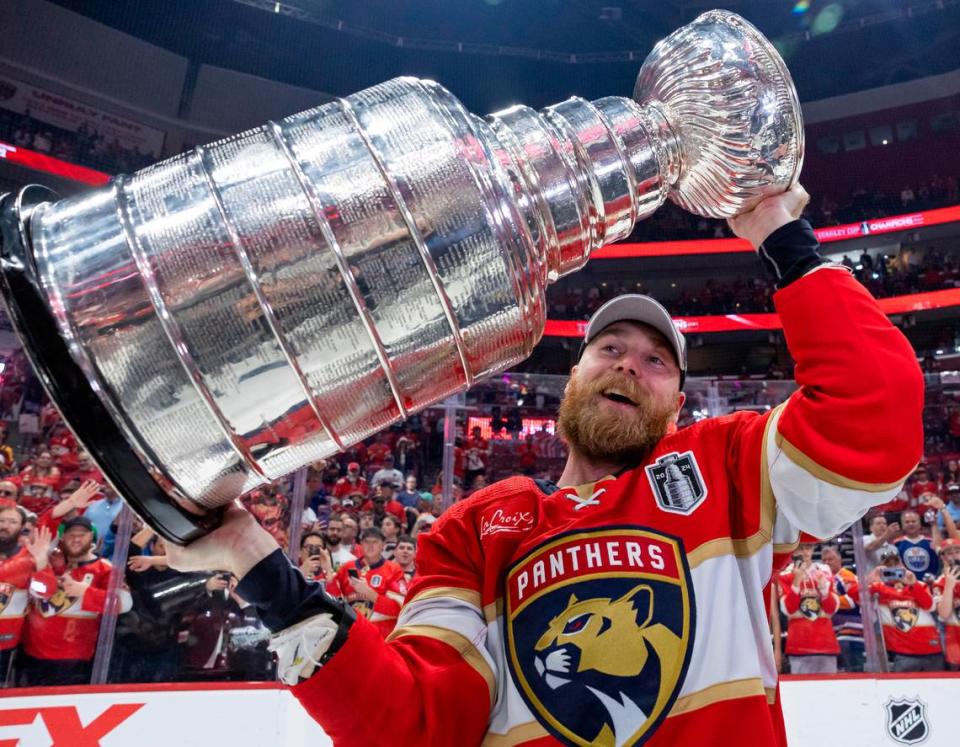 Florida Panthers center Sam Bennett (9) lifts the Stanley Cup