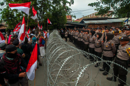 Protesters shout slogans outside the Central Sulawesi General Election Commission (KPU) office in Palu, Indonesia May 22, 2019 in this photo taken by Antara Foto. Antara Foto/Basri Marzuki/ via REUTERS