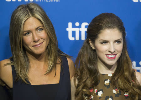 Actresses Jennifer Aniston (L) and Anna Kendrick pose before the "Cake" news conference at the Toronto International Film Festival (TIFF) in Toronto, September 9, 2014. REUTERS/Mark Blinch