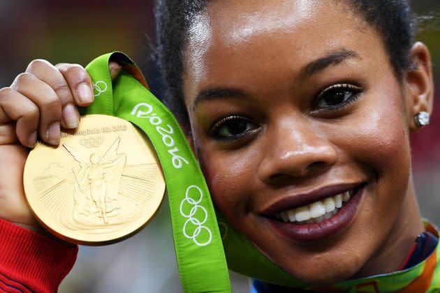 Douglas with her gold medal for the Artistic Gymnastics Women's Team at the 2016 Olympic Games in Rio.