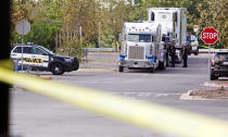 <p>Police officers work on a crime scene after eight people believed to be illegal immigrants being smuggled into the United States were found dead inside a sweltering 18-wheeler trailer parked behind a Walmart store in San Antonio, Texas, July 23, 2017. (Ray Whitehouse/Reuters) </p>