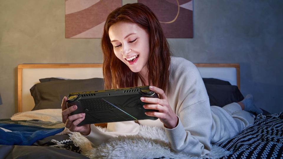 Woman playing ASUS ROG Ally X.