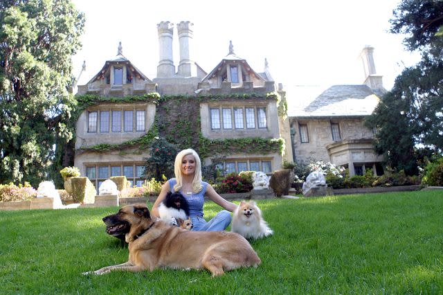 Animal Fair Media/Getty Images Holly Madison with dogs at the Playboy Mansion in 2005