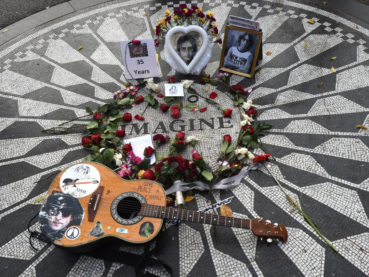 Items left at the mosaic named for John Lennon’s song “Imagine” at Strawberry Fields, the Central Park garden dedicated in his honor in New York. (Photo: Timothy A. Clary/AFP/Getty Images)